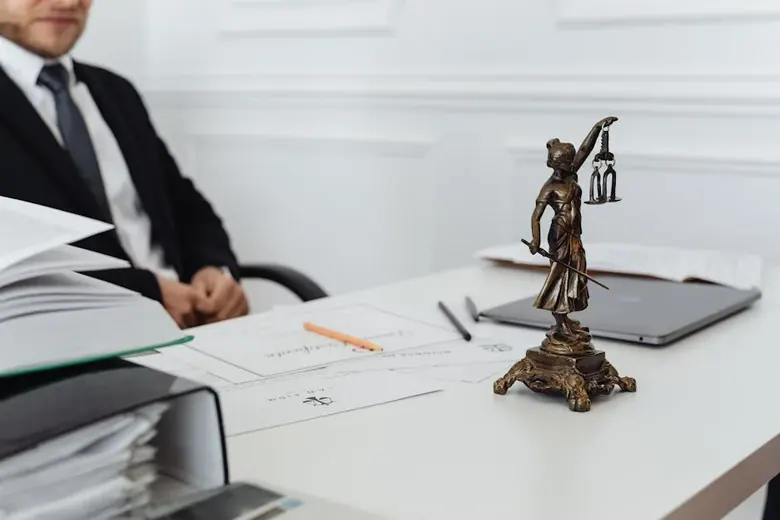 Attorney reviewing legal documents at desk
